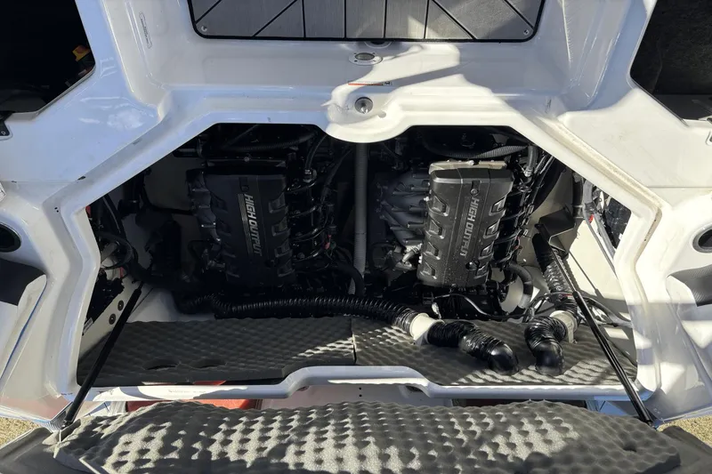 Slide: The Image of 2021 Yamaha Boats 212XE engine compartment with dual high-output engines. - 16