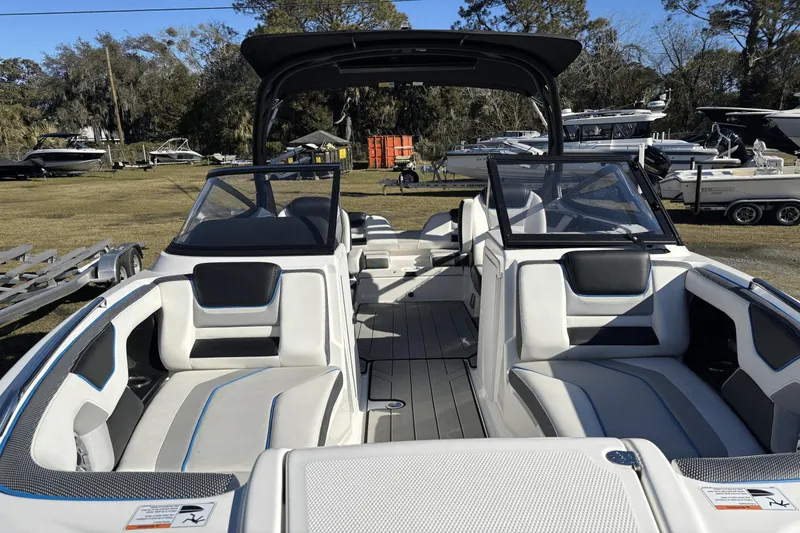 Slide: The Image of 2021 Yamaha Boats 212XE interior with sleek seating and modern design. - 7