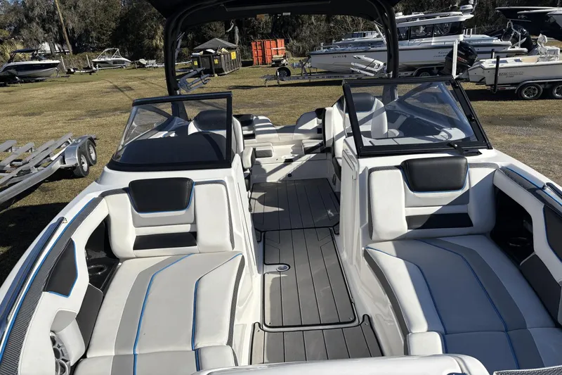 Slide: The Image of 2021 Yamaha Boats 212XE interior with sleek seating and modern design. - 8