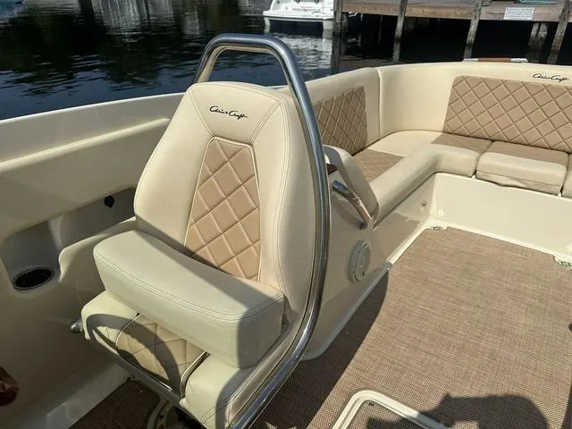 Slide: The Image of 2021 Chris-Craft Launch 27 boat interior with beige leather seating and diamond stitching. - 19