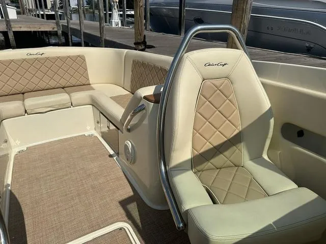Slide: The Image of 2021 Chris-Craft Launch 27 boat interior with beige leather seating and elegant design. - 20