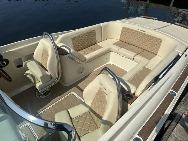Slide: The Image of 2021 Chris-Craft Launch 27 boat interior with luxurious beige seating and elegant design. - 7