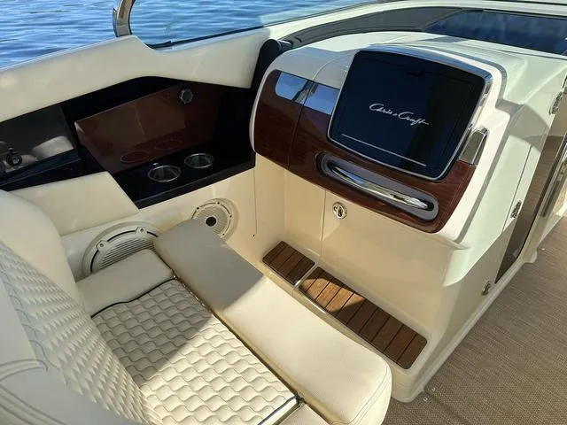 Slide: The Image of 2021 Chris-Craft Launch 31 GT interior with luxurious seating and elegant dashboard design. - 12