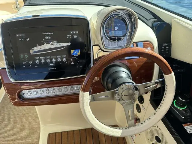 Slide: The Image of Dashboard of 2021 Chris-Craft Launch 31 GT with steering wheel and navigation display. - 14