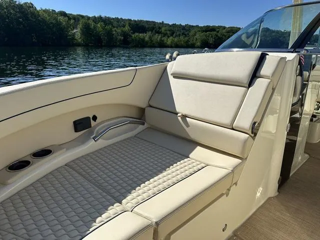 Slide: The Image of 2021 Chris-Craft Launch 31 GT boat interior with luxurious seating on a sunny day. - 18
