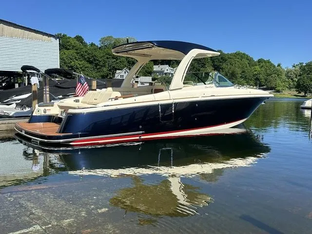 Slide: The Image of 2021 Chris-Craft Launch 31 GT boat on calm water, featuring sleek design and luxury details. - 2