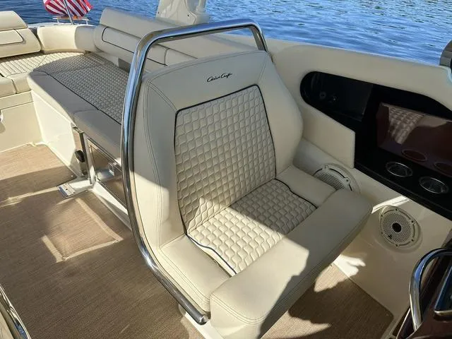 Slide: The Image of Luxurious interior of 2021 Chris-Craft Launch 31 GT boat with elegant seating and water view. - 21