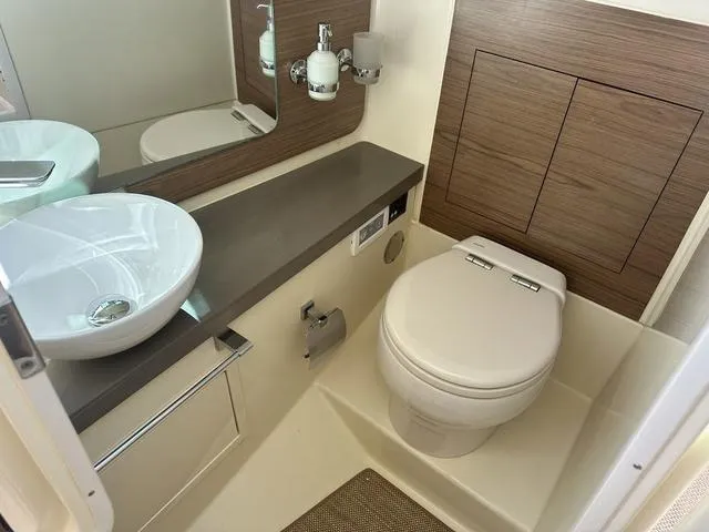 Slide: The Image of 2021 Chris-Craft Launch 31 GT bathroom with modern sink and toilet. - 25