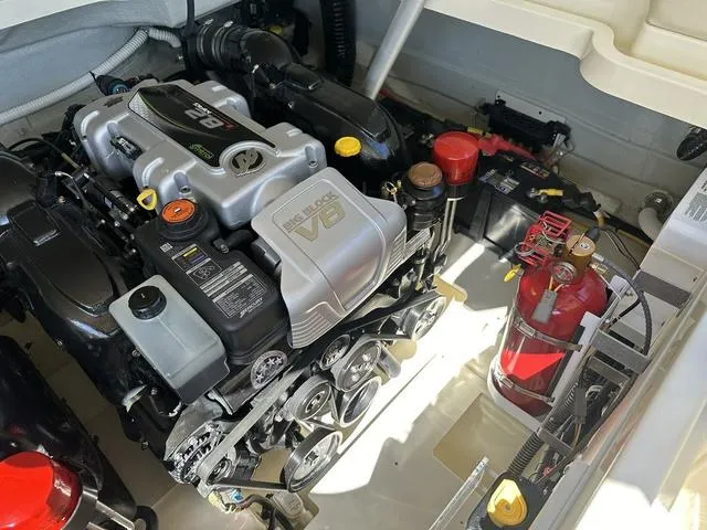 Slide: The Image of 2021 Chris-Craft Launch 31 GT engine compartment with V8 engine and fire extinguisher. - 29
