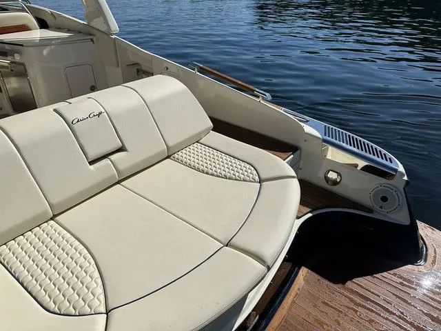 Slide: The Image of 2021 Chris-Craft Launch 31 GT boat with luxurious seating on calm water. - 3
