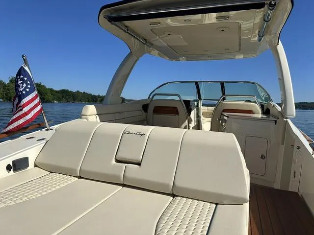 Slide: The Image of 2021 Chris-Craft Launch 31 GT boat interior with American flag on a sunny day. - 5