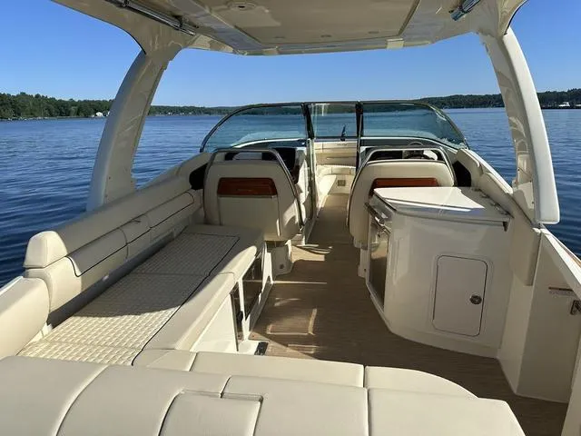Slide: The Image of 2021 Chris-Craft Launch 31 GT boat interior on a serene lake. - 6