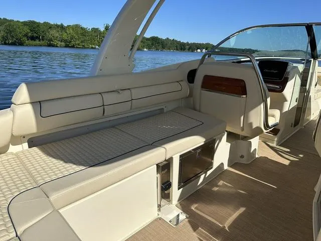 Slide: The Image of 2021 Chris-Craft Launch 31 GT interior, featuring elegant seating and sleek design on a sunny day. - 7
