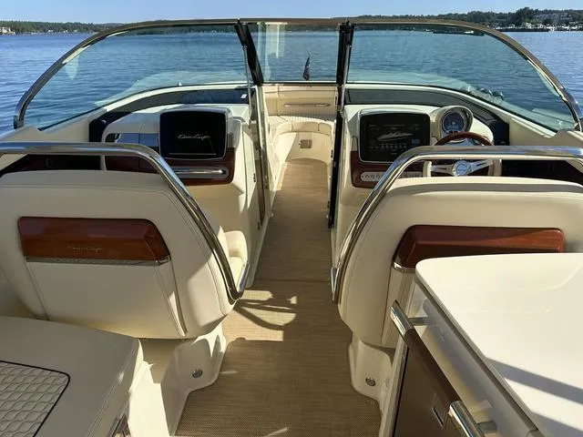 Slide: The Image of Interior of 2021 Chris-Craft Launch 31 GT boat with luxurious seating and dashboard. - 9