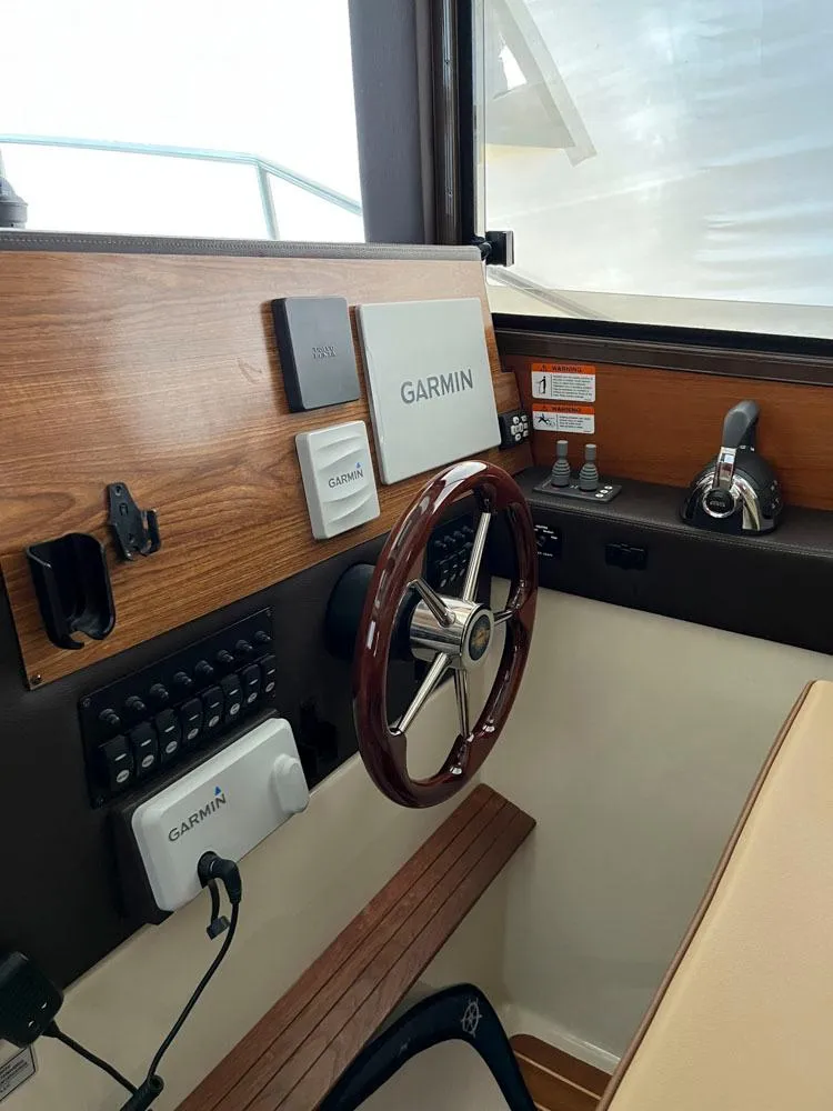 Slide: The Image of 2020 Ranger Tugs R-29 CB helm with Garmin navigation system. - 10