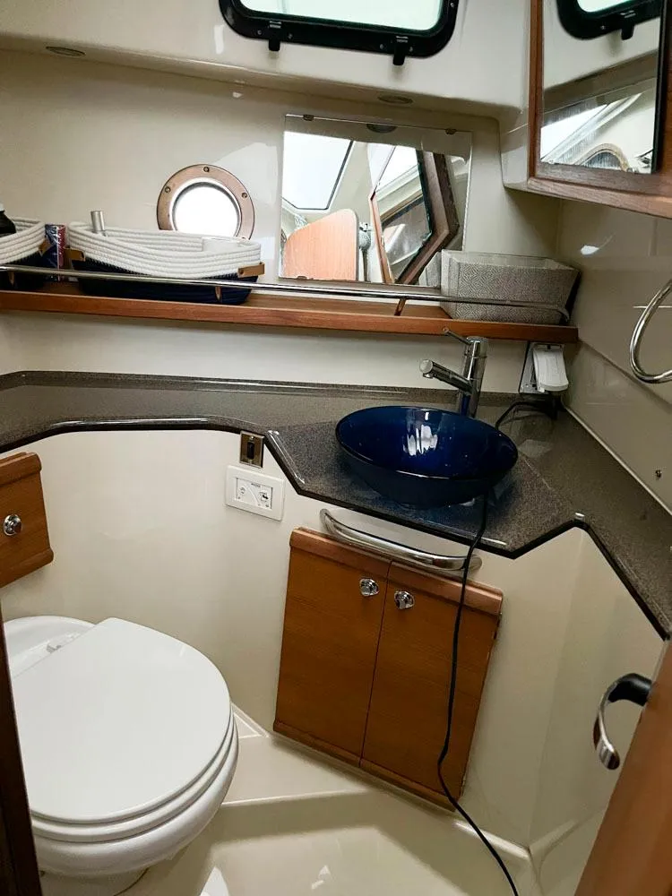 Slide: The Image of 2020 Ranger Tugs R-29 CB bathroom with modern sink and compact design. - 11