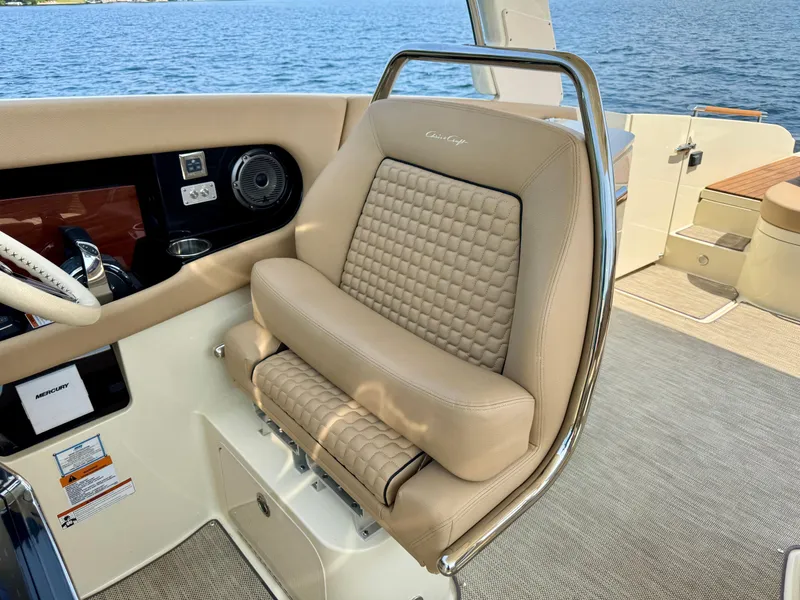 Slide: The Image of Luxurious 2021 Chris-Craft Launch 35 GT boat interior with beige leather seating and steering wheel. - 11