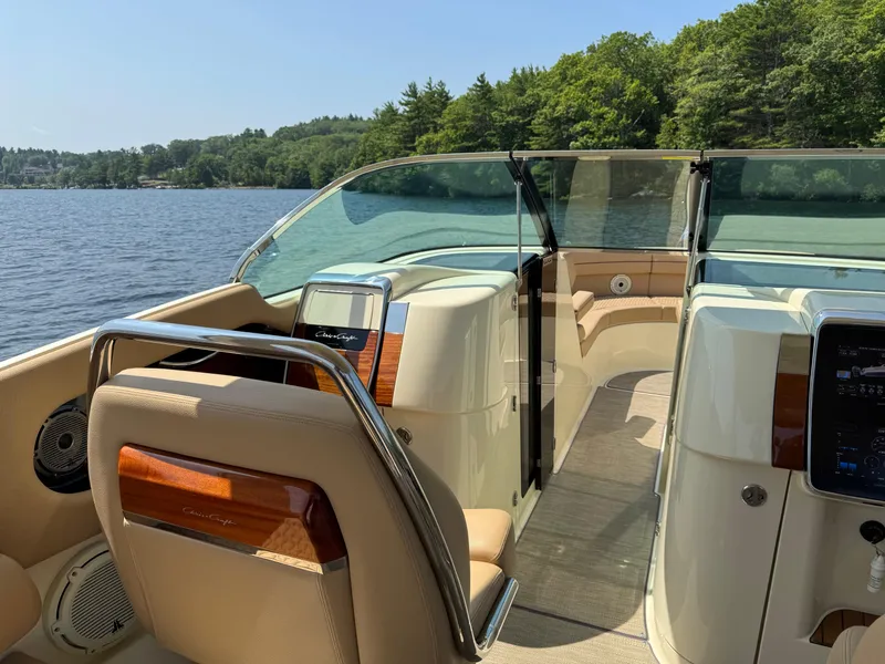 Slide: The Image of 2021 Chris-Craft Launch 35 GT interior with luxurious seating and scenic lake view. - 13