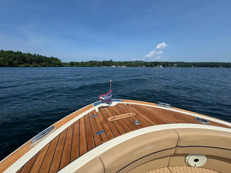 Slide: The Image of 2021 Chris-Craft Launch 35 GT on a serene lake with clear blue skies. - 19