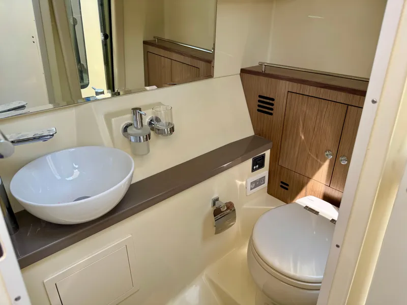 Slide: The Image of Luxurious bathroom interior of 2021 Chris-Craft Launch 35 GT boat, featuring modern sink and toilet. - 21