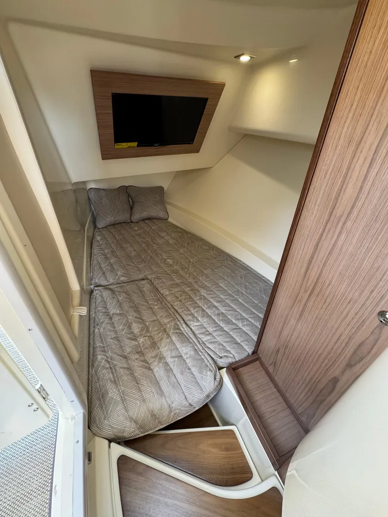 Slide: The Image of 2021 Chris-Craft Launch 35 GT cabin interior with bed and TV. - 23