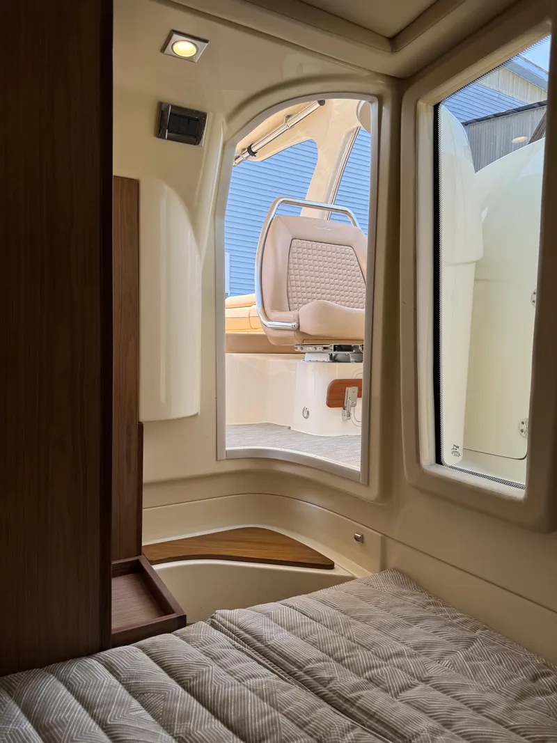 Slide: The Image of Interior view of 2021 Chris-Craft Launch 35 GT, showcasing cabin and seating area. - 24
