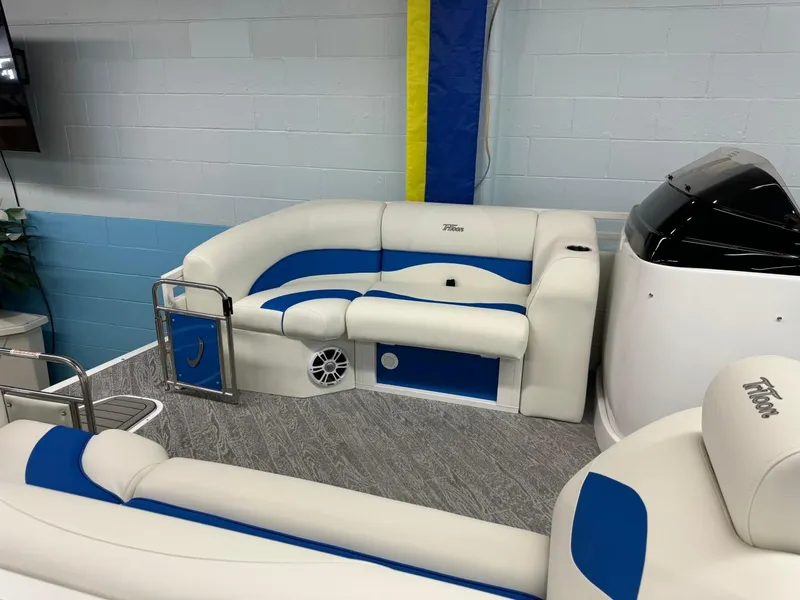 Slide: The Image of 2024 JC Neptoon 23 TT DSL pontoon boat interior with blue and white seating. - 10