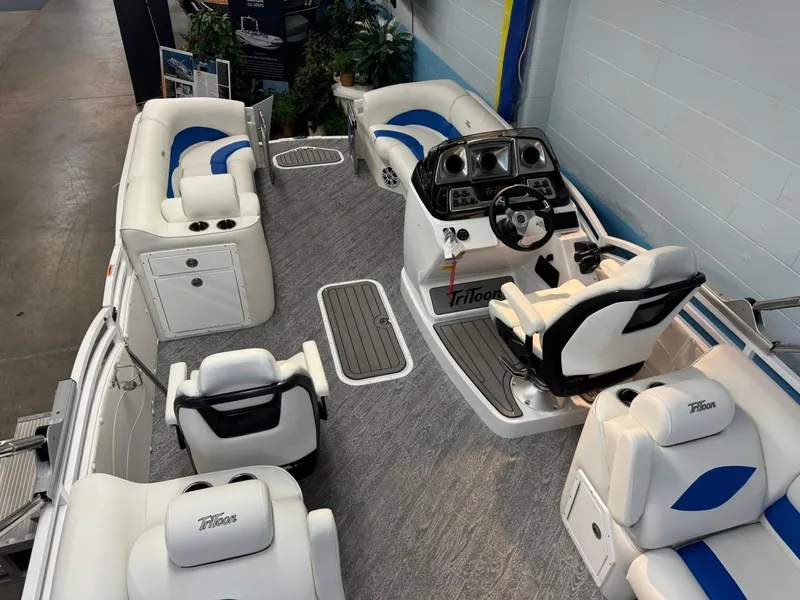 Slide: The Image of 2024 JC Neptoon 23 TT DSL pontoon boat interior with white and blue seating. - 14