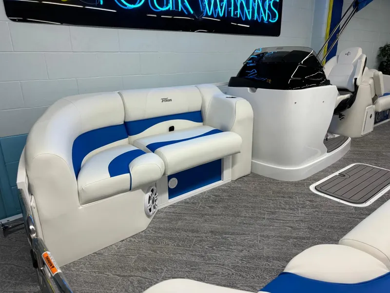 Slide: The Image of 2024 JC Neptoon 23 TT DSL pontoon boat interior with white and blue seating. - 22