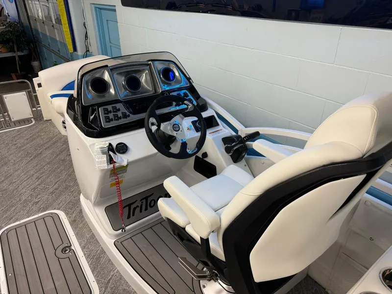 Slide: The Image of 2024 JC Neptoon 23 TT DSL boat interior with modern helm and comfortable seating. - 25