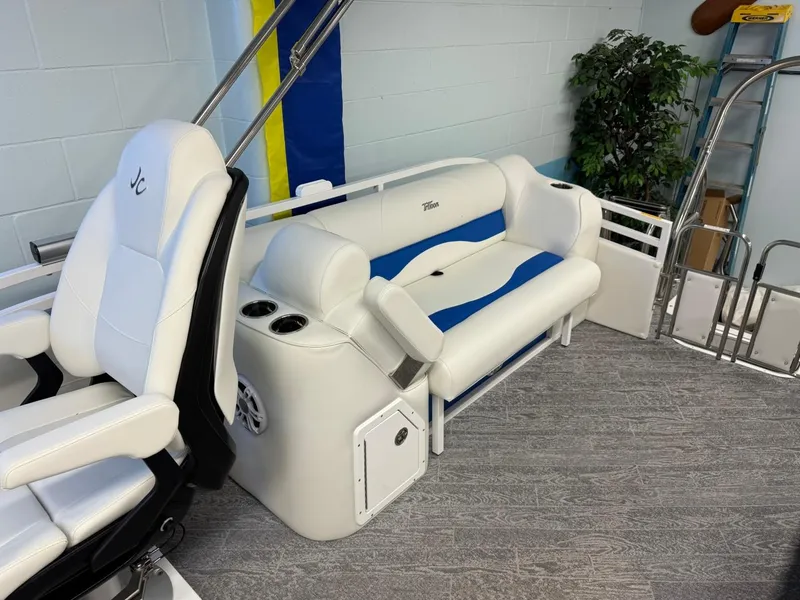 Slide: The Image of 2024 JC Neptoon 23 TT DSL boat interior with white and blue seating. - 28