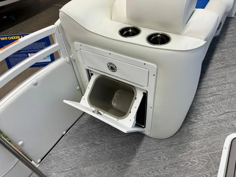 Slide: The Image of 2024 JC Neptoon 23 TT DSL boat interior with storage compartment and cup holders. - 36