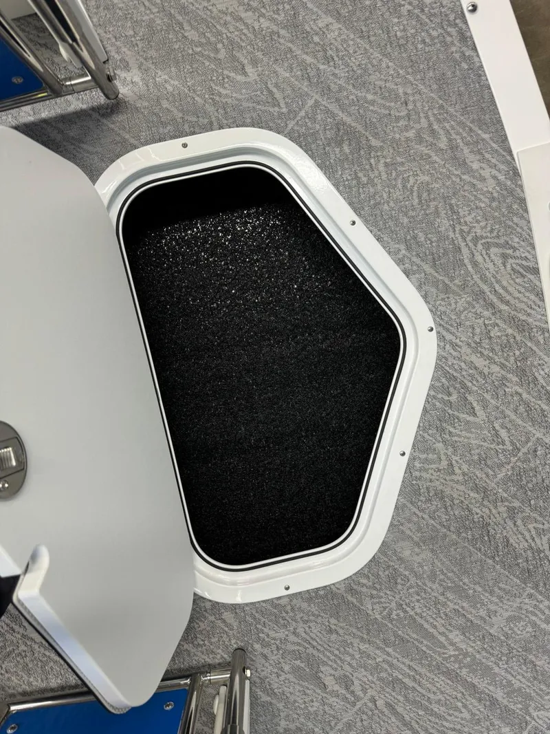 Slide: The Image of 2024 JC Neptoon 23 TT DSL boat storage compartment with open hatch. - 38