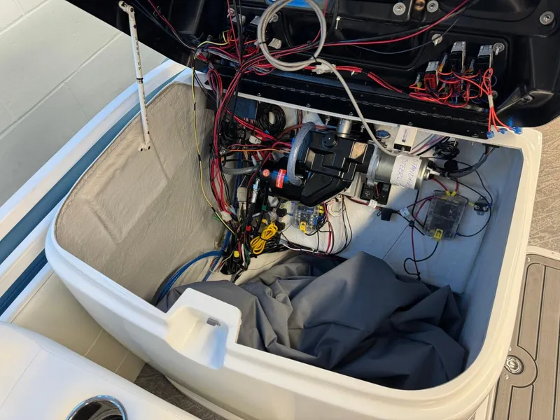 Slide: The Image of Open engine compartment of 2024 JC Neptoon 23 TT DSL boat, showing wiring and components. - 41