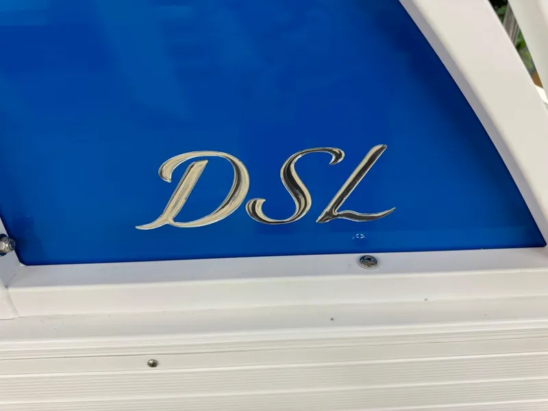 Slide: The Image of 2024 JC Neptoon 23 TT DSL boat with blue panel and DSL lettering. - 44