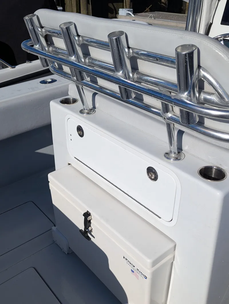 Slide: The Image of 2019 Contender 30T boat with rod holders and storage compartment. - 11