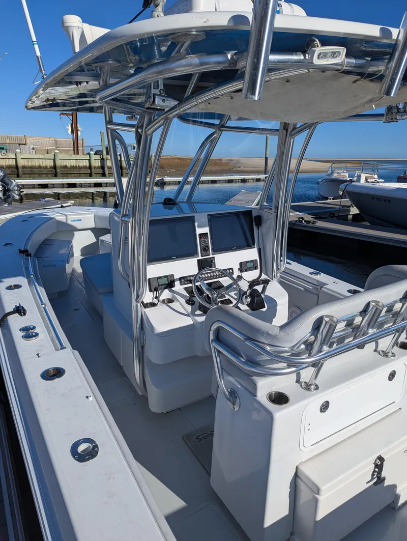 Slide: The Image of 2019 Contender 30T boat interior with dual screens and steering console. - 4