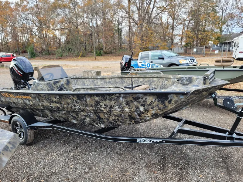 The Image of 2025 Excel 1651 River Warrior boat on trailer, camo design, parked outdoors. - 0