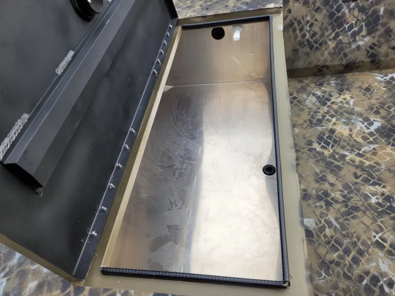 Slide: The Image of Open storage compartment in 2025 Excel 1651 River Warrior boat. - 3