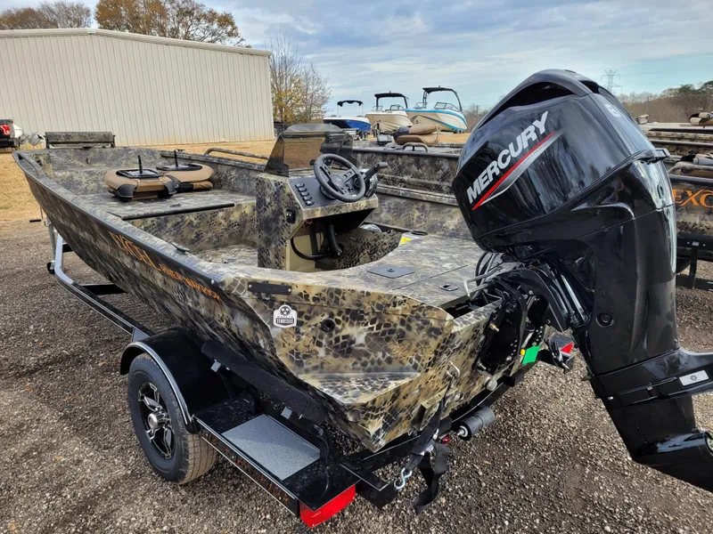 Slide: The Image of 2025 Excel 1651 River Warrior boat with Mercury outboard motor, camo design. - 6