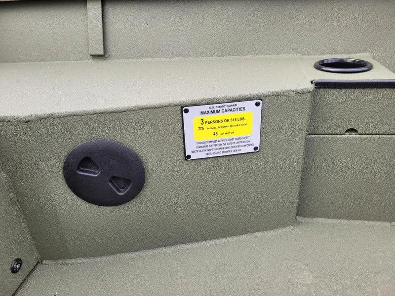 Slide: The Image of Excel Eclipse 2025 boat interior with capacity label and cup holder. - 2