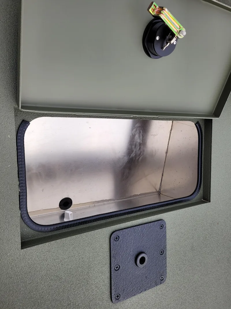 Slide: The Image of 2025 Excel Eclipse interior compartment with open hatch and reflective surface. - 3