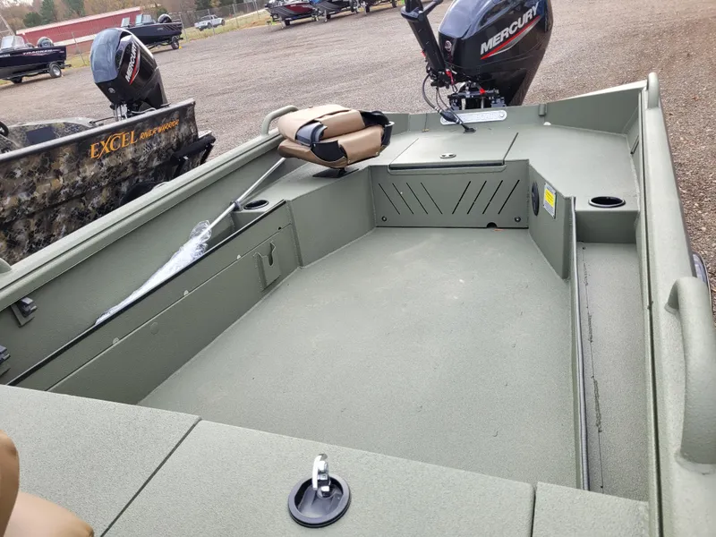 Slide: The Image of 2025 Excel Eclipse boat interior with Mercury outboard motor, featuring spacious seating and storage. - 4