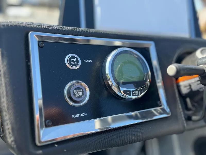 Slide: The Image of 2024 Ranger Z521R control panel with ignition and horn buttons. - 11