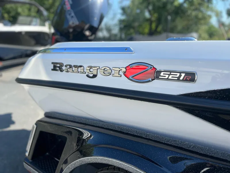 Slide: The Image of 2024 Ranger Z521R boat, close-up of logo and model details. - 3