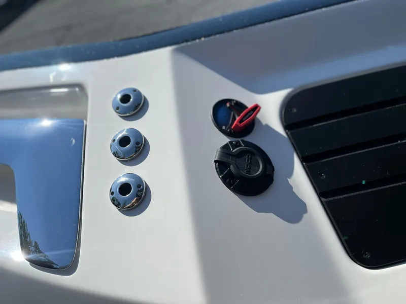 Slide: The Image of 2024 Ranger Z521R boat dashboard controls and switches close-up. - 7