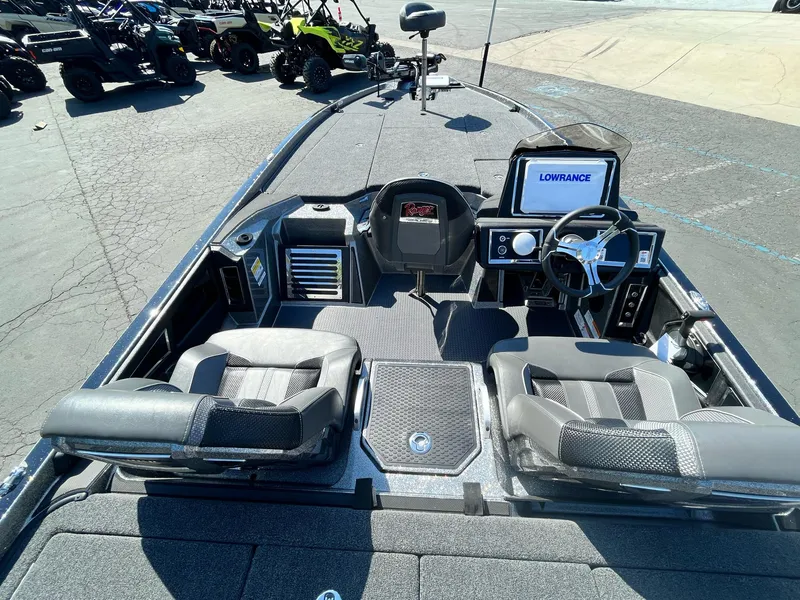 Slide: The Image of 2024 Ranger Z521R boat interior with dual seats and Lowrance electronics. - 9
