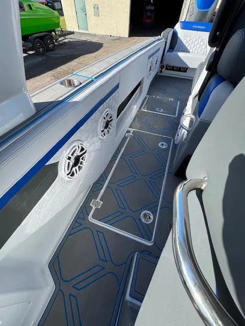 Slide: The Image of 2025 Statement 380 Open boat interior with modern design and blue accents. - 10