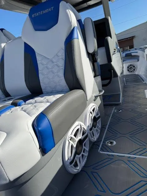 Slide: The Image of Luxury seating in 2025 Statement 380 Open boat with modern design and speakers. - 13
