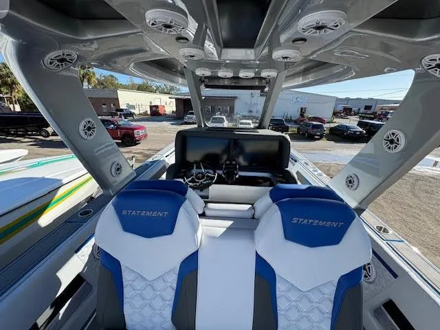 Slide: The Image of Interior view of 2025 Statement 380 Open boat with blue and white seating. - 3